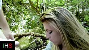 A beautiful girl with blue eyes has sex in the woods