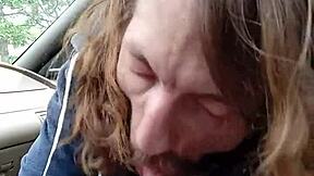 Gay couple having fun with a morning blowjob in a car