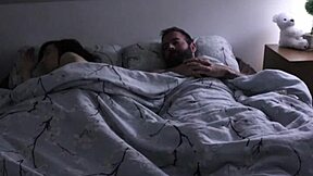A hot scene of a stepson and stepmother having sex in a bedroom