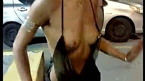 Public show of the hairy beauty with a costume and a downblouse tease