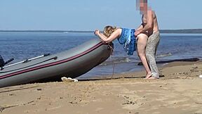 Tourist and boatman in hot scene at the beach