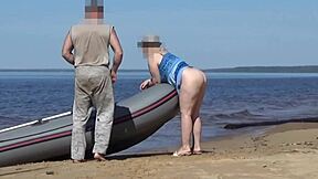 Tourist and boatman in hot scene at the beach