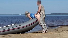 Tourist and boatman in hot scene at the beach