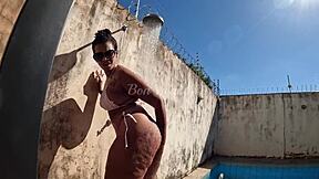 Big tits bouncing while taking a hot outdoor shower