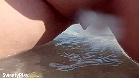 Public beach action: a shaved pussy peeing scene