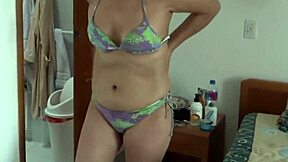 Mature Latina shows off her big ass on the beach
