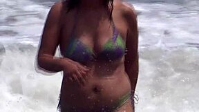 Mature Latina shows off her big ass on the beach