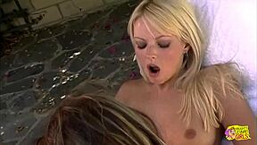 Lesbians try out a sex toy by the pool