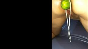 A cucumber on her juicy butt