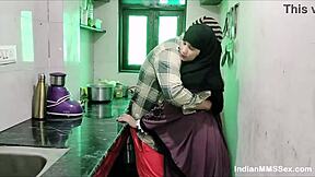 Hot wife in burqa giving a blowjob to her husband in their kitchen