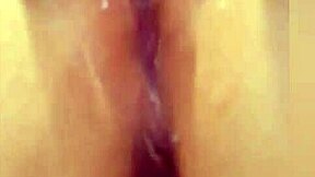 A small white girl with piercings has an orgasm in this video