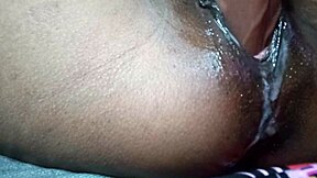 Black beauty enjoys dildo play with creamy satisfaction