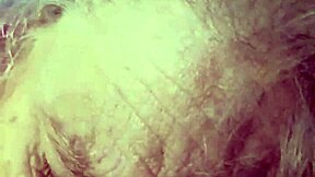 A sexy woman in her prime is giving a blow job to a large penis