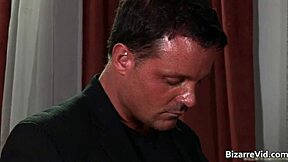 This is a BDSM video with a hot scene of deep throat and spanking