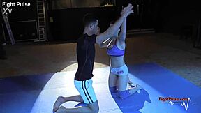 Dominant female and submissive male in real wrestling match