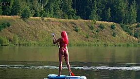 Tiny bikini clad beauty shows off her slim body outside