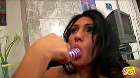 Brunette babes share huge dildo in their wet pussies