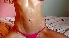 Vanessa Hastings in a micro bikini with an oily body and a small waist