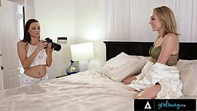 The photographer passes the camera on the pretty model