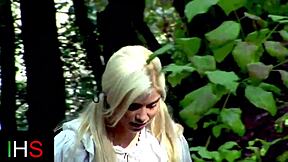 A girl is having a fantastic threesome with two guys outdoors