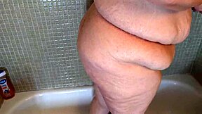 Hot sexy mature BBW woman taking shower, dripping wet