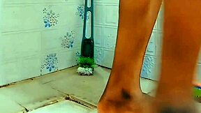 Feminized sissy pees in the chastity cage