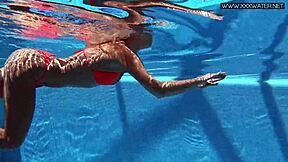 A gorgeous Russian girl in a swimsuit is enjoying the pool