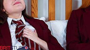Two young British students compare aptitudes in uniform