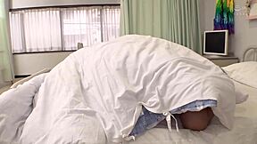 Nurse's gentle face and small breasts tightly embracing in the blanket