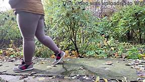 Damn! This curvy milf in leggings squats and pisses right beside me!