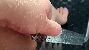 Stepsis unleashes fierce masturbation in a sunny shower with raw intensity.