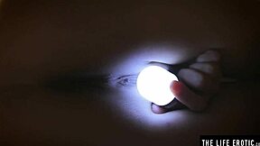 Sleepless teen rubs clit under dim light