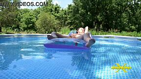 an older woman finds herself wet and excited by the poolside, where she indulges in some solo time outdoors, flashing and touching herself in the sunlight