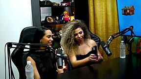 Latina lesbians Daniely and Patricia Red kiss during the podcast close up, leaving Ruan speechless with their natural tits