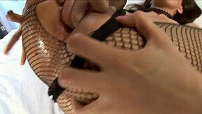 brunette in fishnet lingerie fisting shaved pussy with dildo in bath
