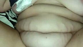 This chubby redhead milf spreads her legs wide on the bed as a guy pounds her fat pussy walls hard until she moans.